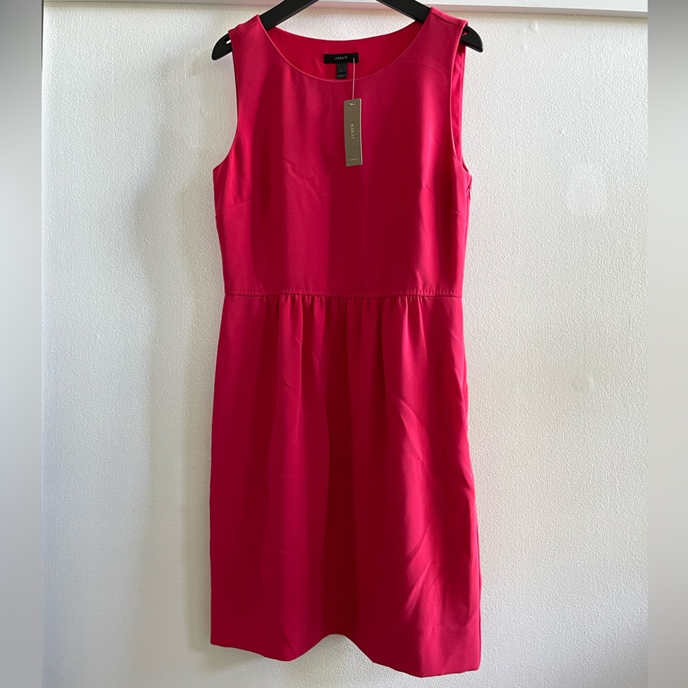 Jcrew pink midi dress in size 2. Never worn with tags.